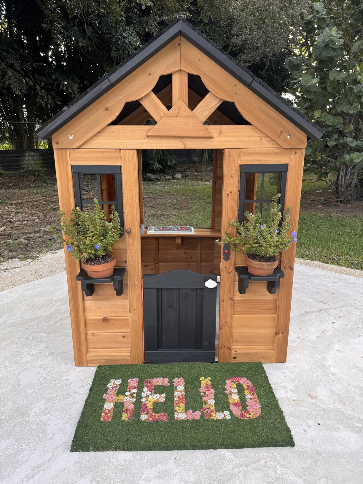 Backyard Discovery Sweetwater Cedar Wooden Kids Playhouse Cottage with Play Kitchen, Snack Bar, Half Door, Toy Phone, Windows, Flowerpot Holders, and Working Doorbell for Outdoor Imaginative Play - Customer Photo 1