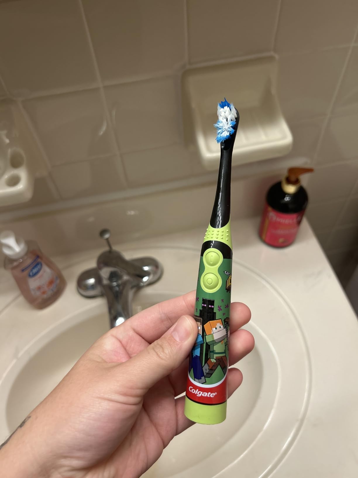 Colgate Kids Battery Powered Minecraft Toothbrush, Extra Soft Kids Battery Toothbrush with 1 AA Battery Included, Made for Ages 3 and Up, Features Easy On and Off Switch, Flat Lay Handle, 1 Count - Customer Photo 2